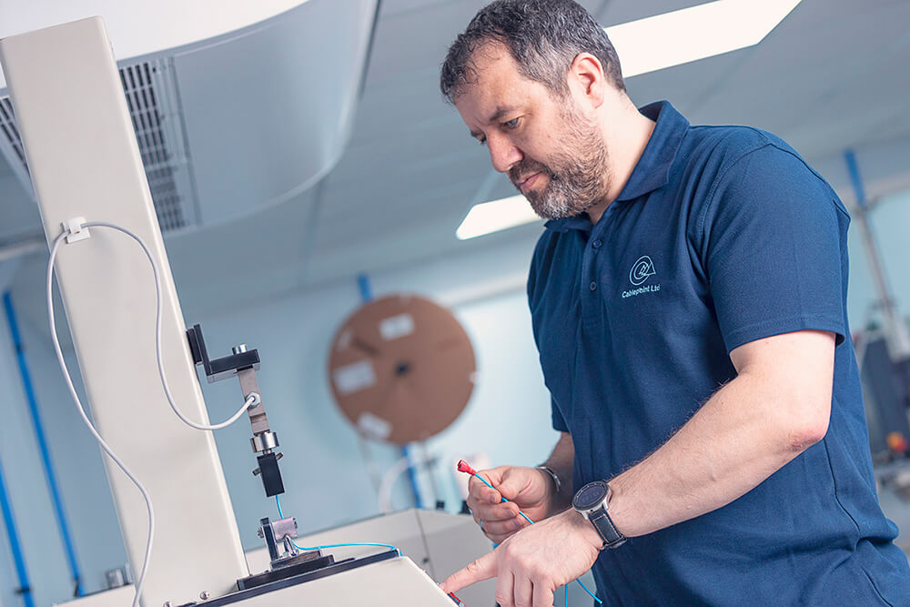 Engineer working at cable manufacturing station